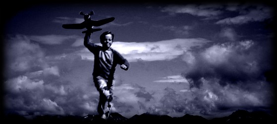 Photo of boy with toy plane